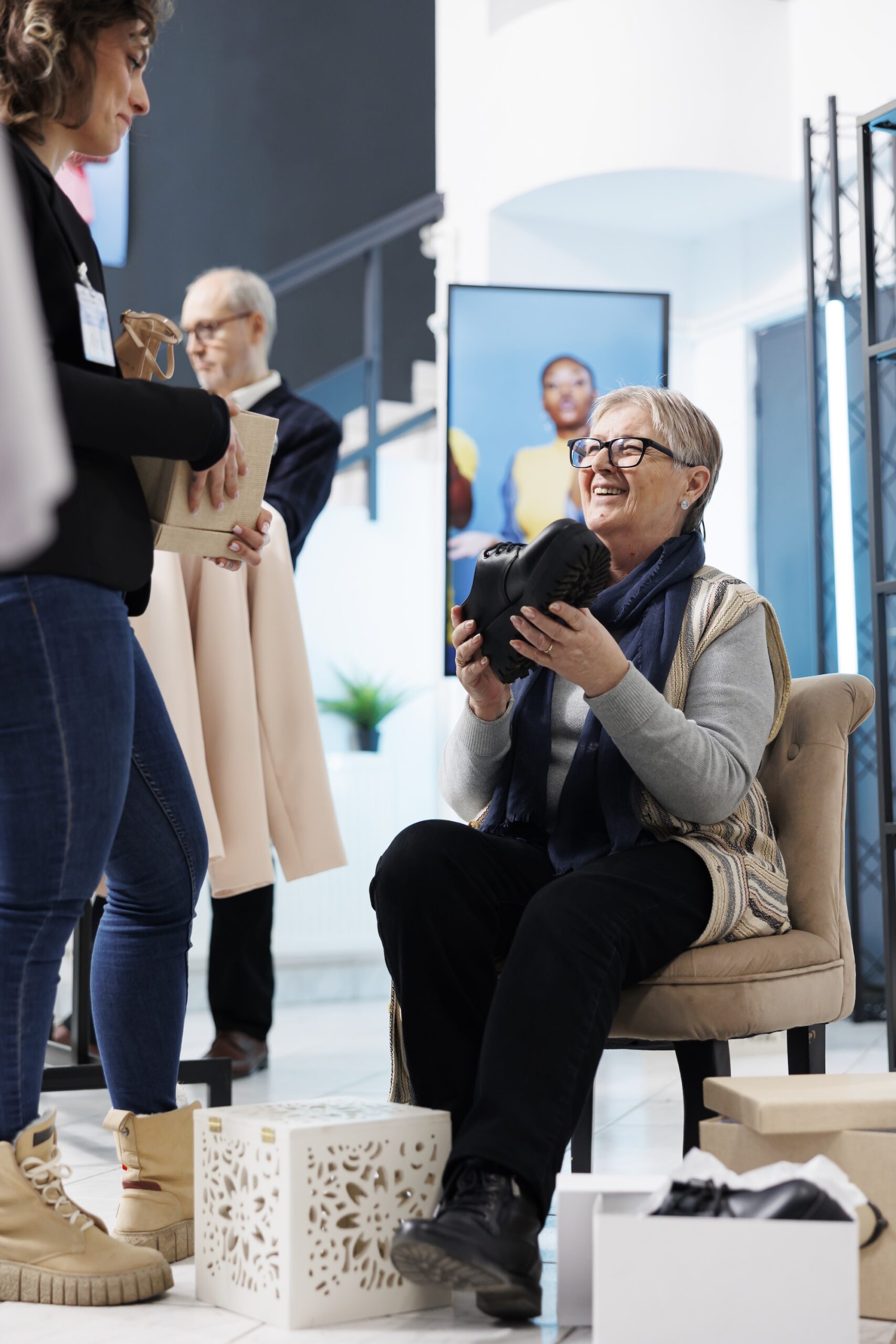 Senior woman trying fashionable black shoes
